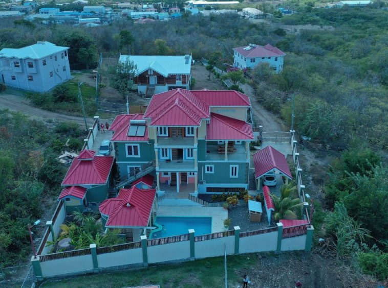 Tri-level villa for sale in Massade, Gros Islet with pool, rental units, and luxury finishes. Ideal for investment or upscale living in St. Lucia.