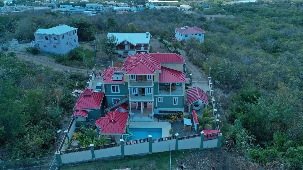 Tri-level villa for sale in Massade, Gros Islet with pool, rental units, and luxury finishes. Ideal for investment or upscale living in St. Lucia.